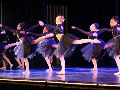 group of ballerinas dancing on stage